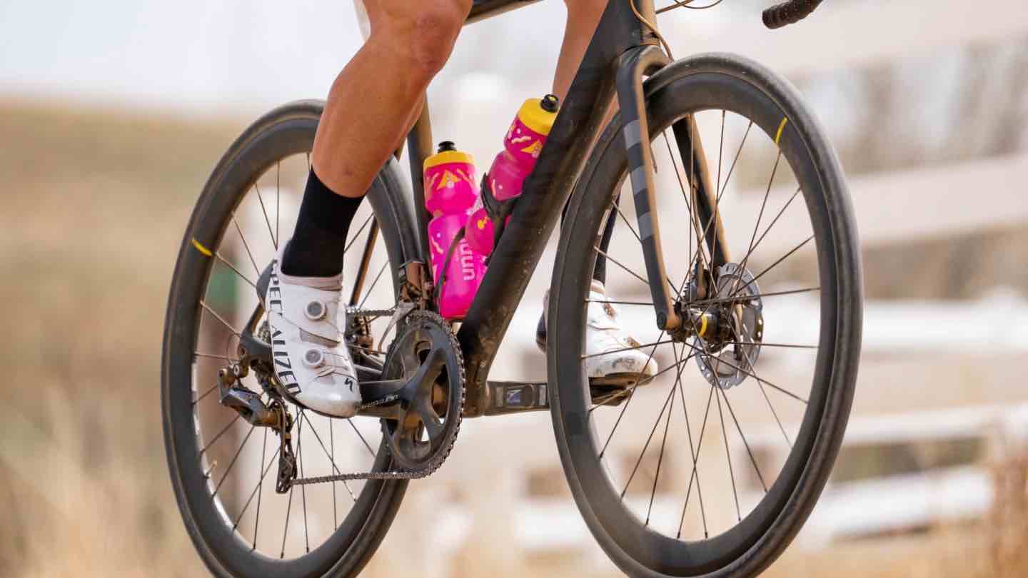 Road bike with pink water bottles